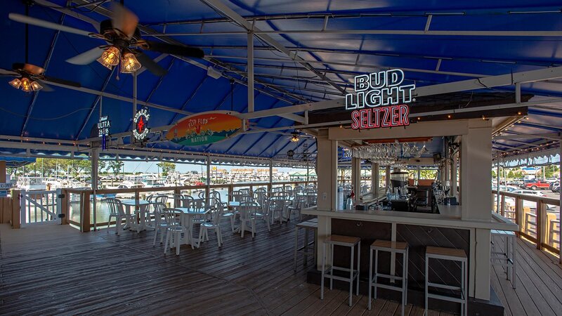 Outdoor dining area with view of seating area and bar