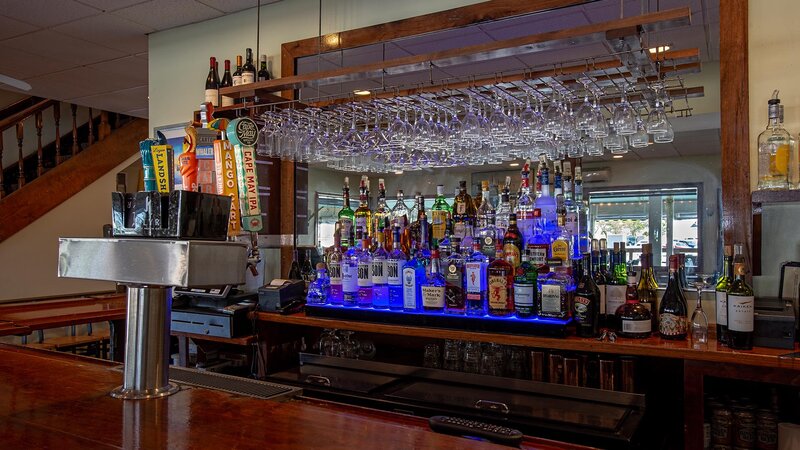 Inside bar with beer taps and liquor bottles